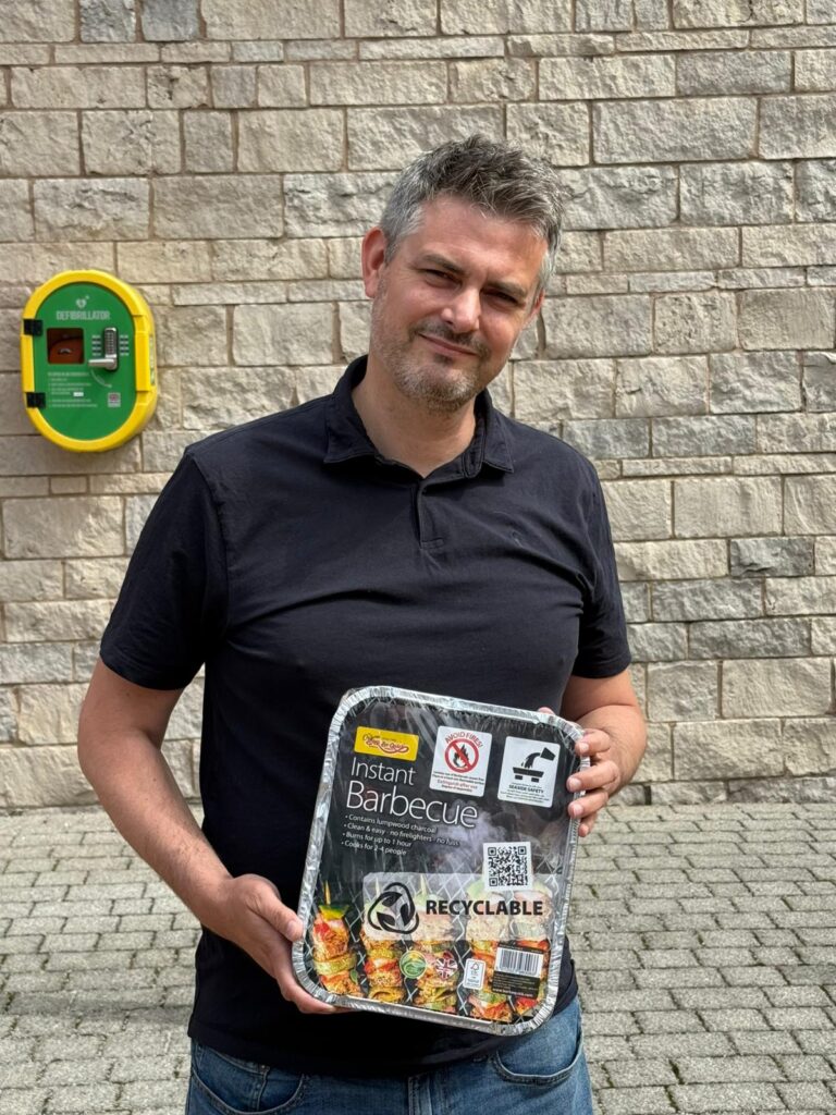 Jon Pearce MP Holding a BBQ