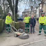 Councillor Godfrey Claff (third from the left) joined AES colleagues to help clean the alleyways and streets.