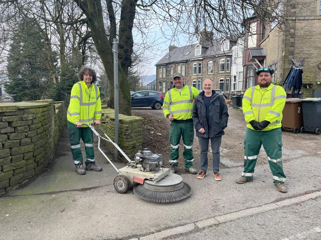 Councillor Godfrey Claff (third from the left) joined AES colleagues to help clean the alleyways and streets.