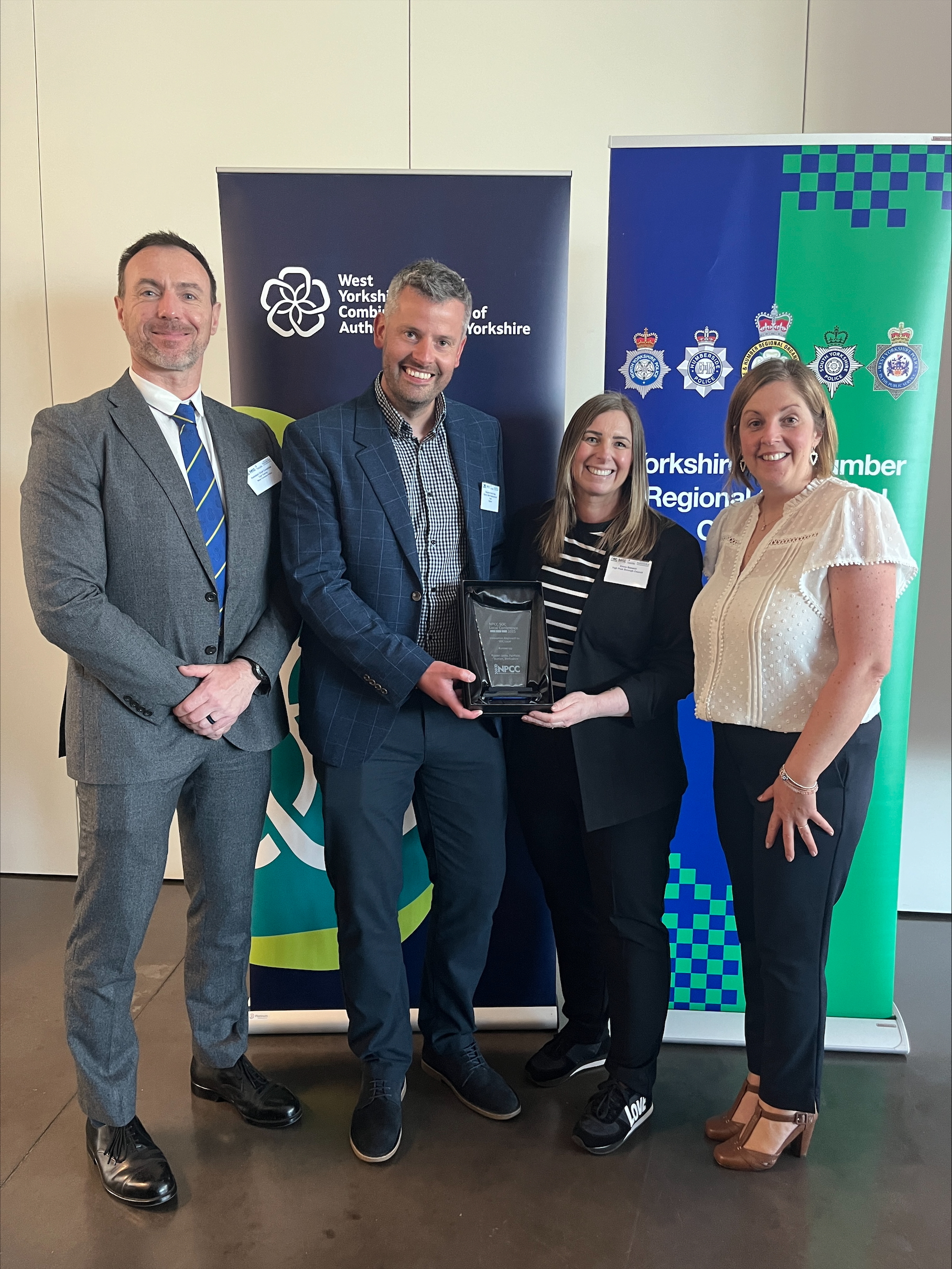 Council officer Emma Beswick (second right) accepts the award with colleagues from Derbyshire and West Yorkshire Police.