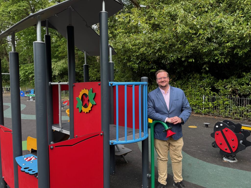 Councillor Damien Greenhalgh at the toddler play area where new play equipment was installed earlier this year. Credit: HPBC
