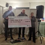 Cllr Sloman presents the cheque to Building Bridges. Credit: HPBC